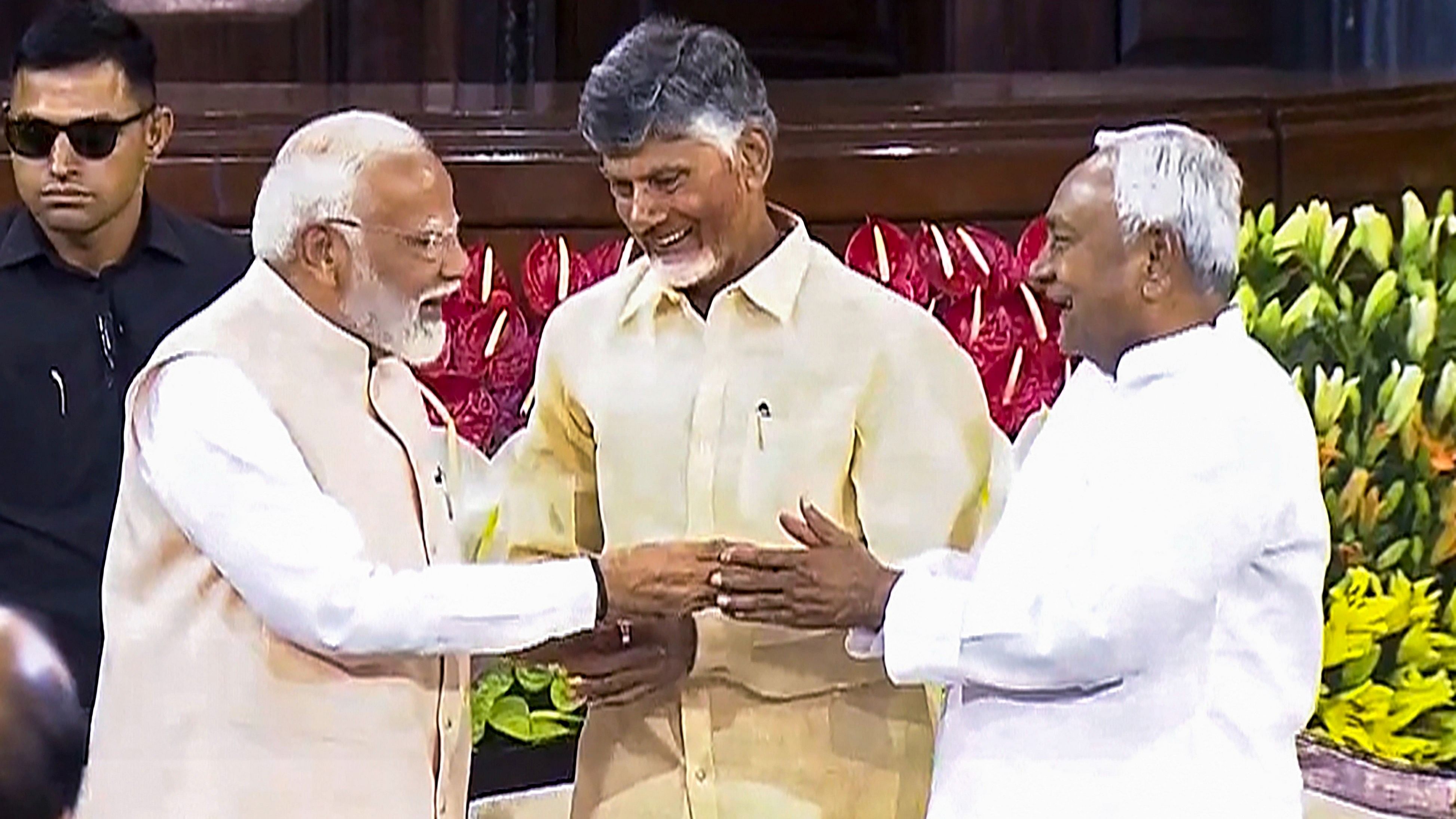 <div class="paragraphs"><p>PM Narendra Modi with TDP chief N Chandrababu Naidu and Bihar CM and JD(U) leader Nitish Kumar.</p></div>