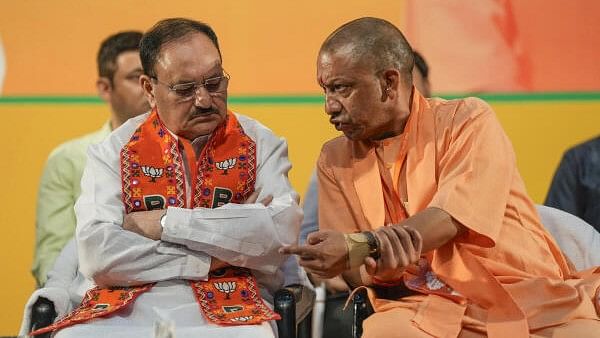 <div class="paragraphs"><p>Uttar Pradesh Chief Minister Yogi Adityanath interacts with Union Minister and BJP National President JP Nadda during the party’s state working committee meeting, in Lucknow, Sunday, July 14, 2024.</p></div>