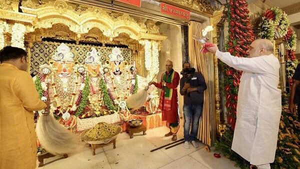 <div class="paragraphs"><p>Union Home Minister Amit Shah offers prayers at the Jagannath Temple on 'Rath Yatra' festival, in Ahmedabad, Sunday on July 7, 2024.</p></div>