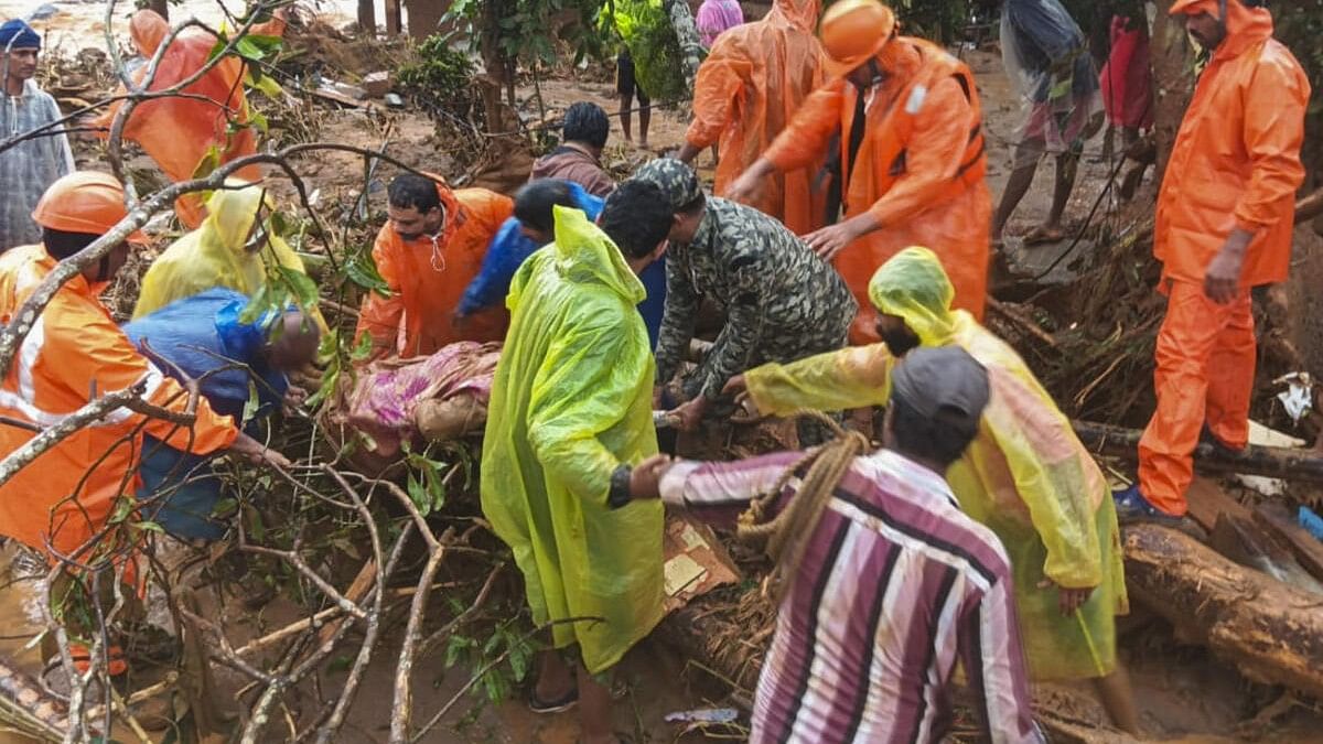 <div class="paragraphs"><p>NDRF personnel conduct rescue operation after huge landslides in the hilly areas near Meppadi, in Wayanad district, Kerala, Tuesday, July 30, 2024. </p></div>