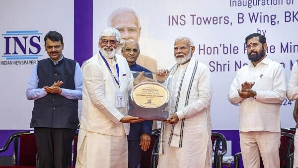 <div class="paragraphs"><p>Prime Minister Narendra Modi with Maharashtra Chief Minister Eknath Shinde and Deputy Chief Minister Devendra Fadnavis during the inauguration of Indian Newspaper Society (INS) Towers, in Mumbai, Saturday, July 13, 2024. </p></div>