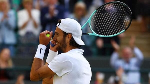 <div class="paragraphs"><p>Wimbledon - All England Lawn Tennis and Croquet Club, London, Britain - Italy's Lorenzo Musetti celebrates after winning his quarter final match against Taylor Fritz of the US.</p></div>