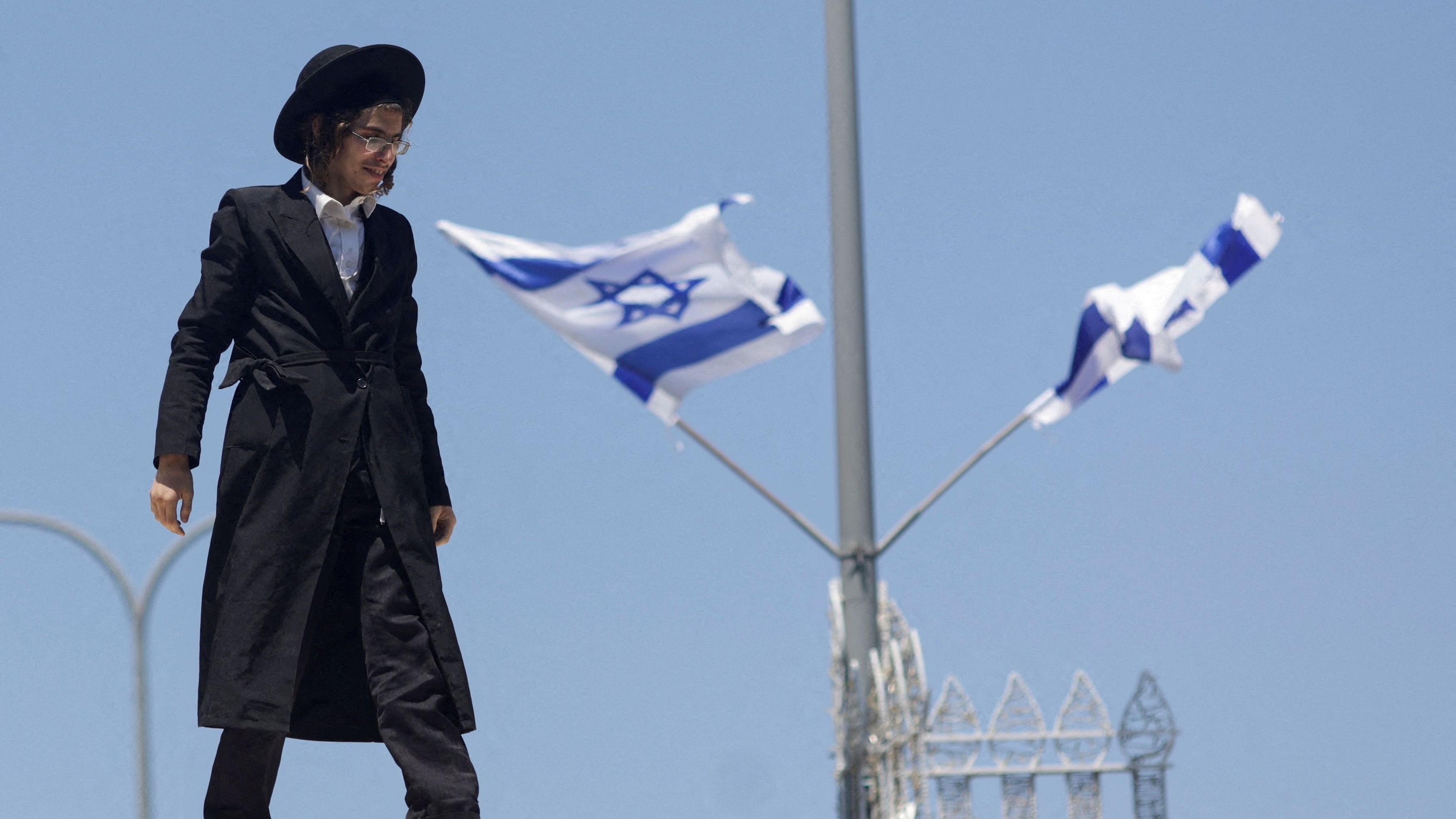 <div class="paragraphs"><p>An ultra-Orthodox Jewish man reacts during a demonstration after the Supreme Court ruled in June that the defence ministry could no longer grant blanket exemptions to Jewish seminary students from military conscription.</p></div>