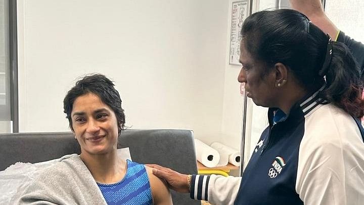 <div class="paragraphs"><p>P T Usha with Vinesh Phogat.</p></div>