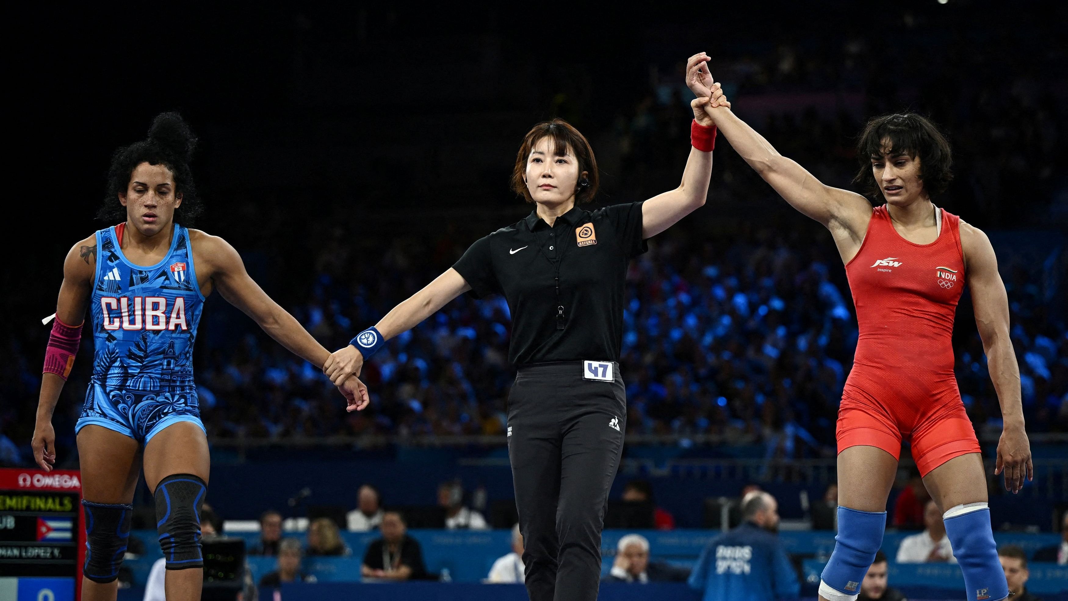 <div class="paragraphs"><p>Vinesh Phogat of India celebrates after winning the match against Yusneylis Guzman Lopez of Cuba.</p></div>