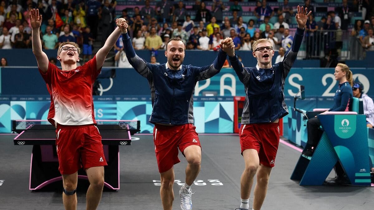 <div class="paragraphs"><p>Felix Lebrun of France, Alexis Lebrun of France and Simon Gauzy of France celebrate after winning their quarterfinal match against team of Brazil.</p></div>