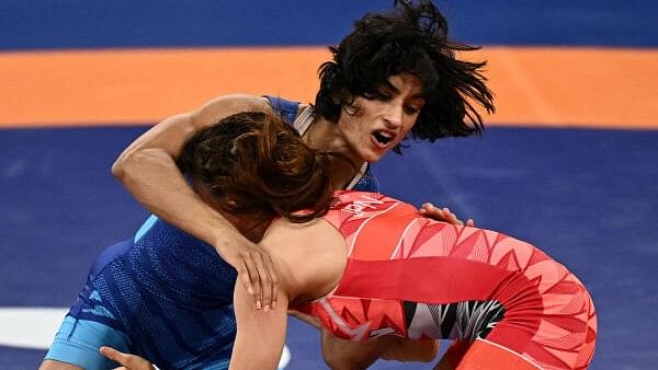 <div class="paragraphs"><p>Yui Susaki of Japan in action with Vinesh Phogat of India at Paris Games 2024.</p></div>