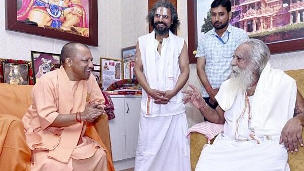 <div class="paragraphs"><p>Uttar Pradesh Chief Minister Yogi Adityanath with the President of Shri Ram Janmbhoomi Teerth Kshetra Mahant Nritya Gopal Das Ji Maharaj, in Ayodhya. </p></div>