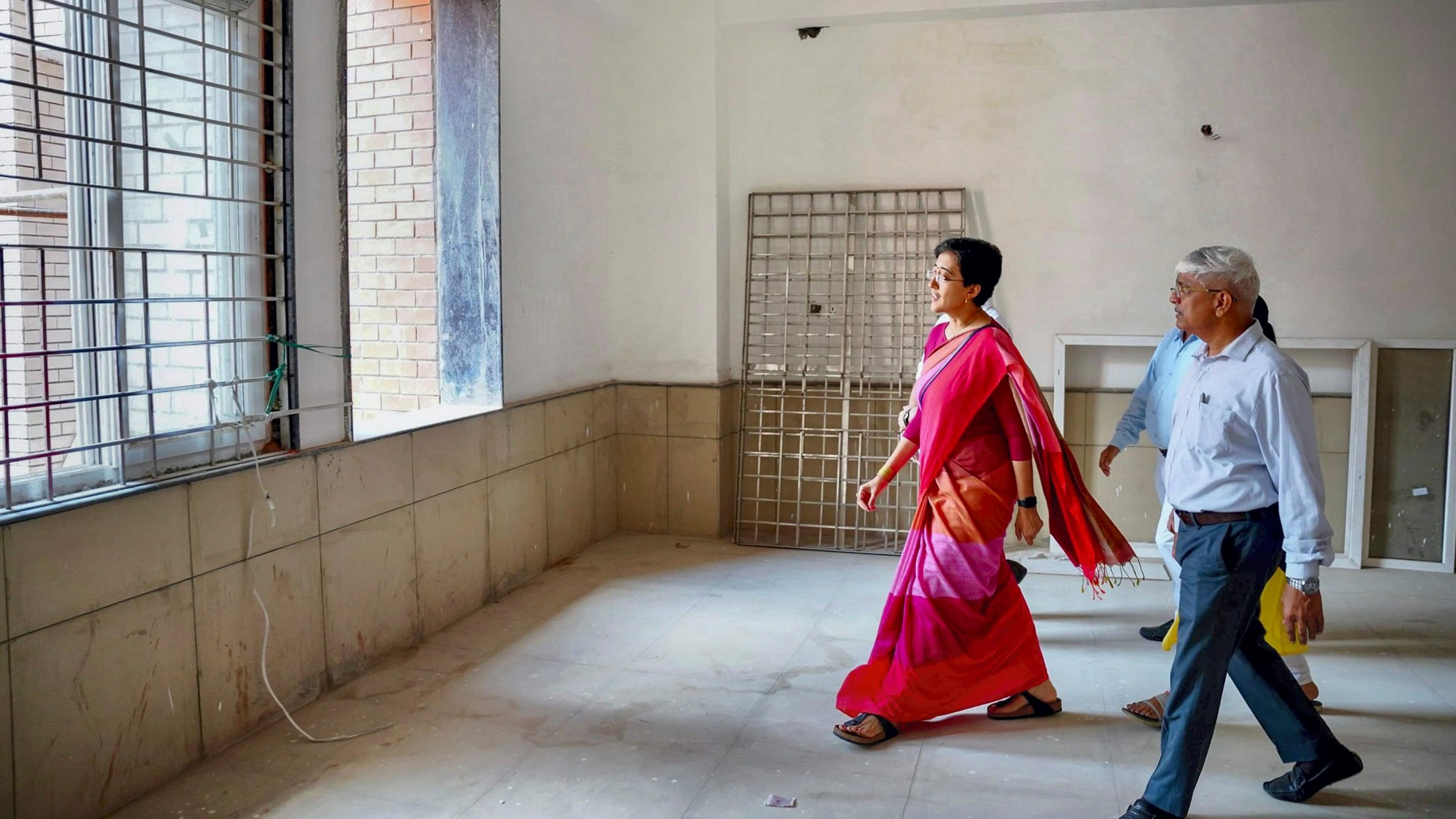 <div class="paragraphs"><p>Delhi Minister Atishi inspects an under construction school building at Sundar Nagari, in New Delhi.   </p></div>