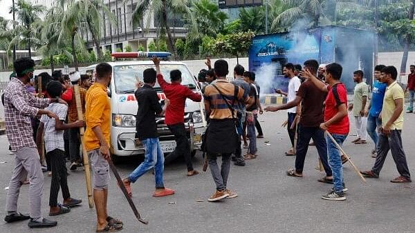 <div class="paragraphs"><p>Demonstrators stop an ambulance to check whether there are any patients inside before allowing it to leave during a protest demanding the stepping down of Bangladeshi Prime Minister Sheikh Hasina, following quota reform protests by students, in Dhaka, Bangladesh.</p></div>