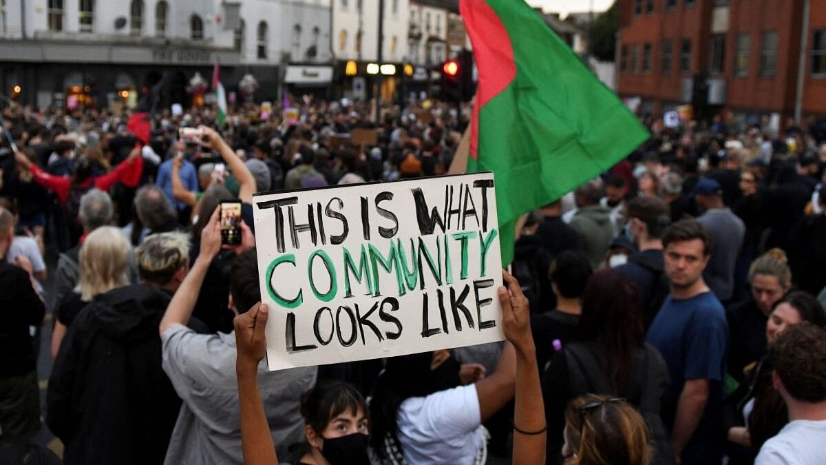 <div class="paragraphs"><p>People gather against an anti-immigration protest, in London, Britain.</p></div>