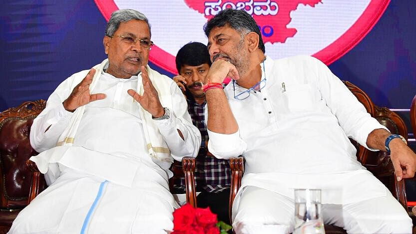 <div class="paragraphs"><p>File photo of Karnataka CM Siddaramaiah and his deputy D K Shivakumar.</p></div>