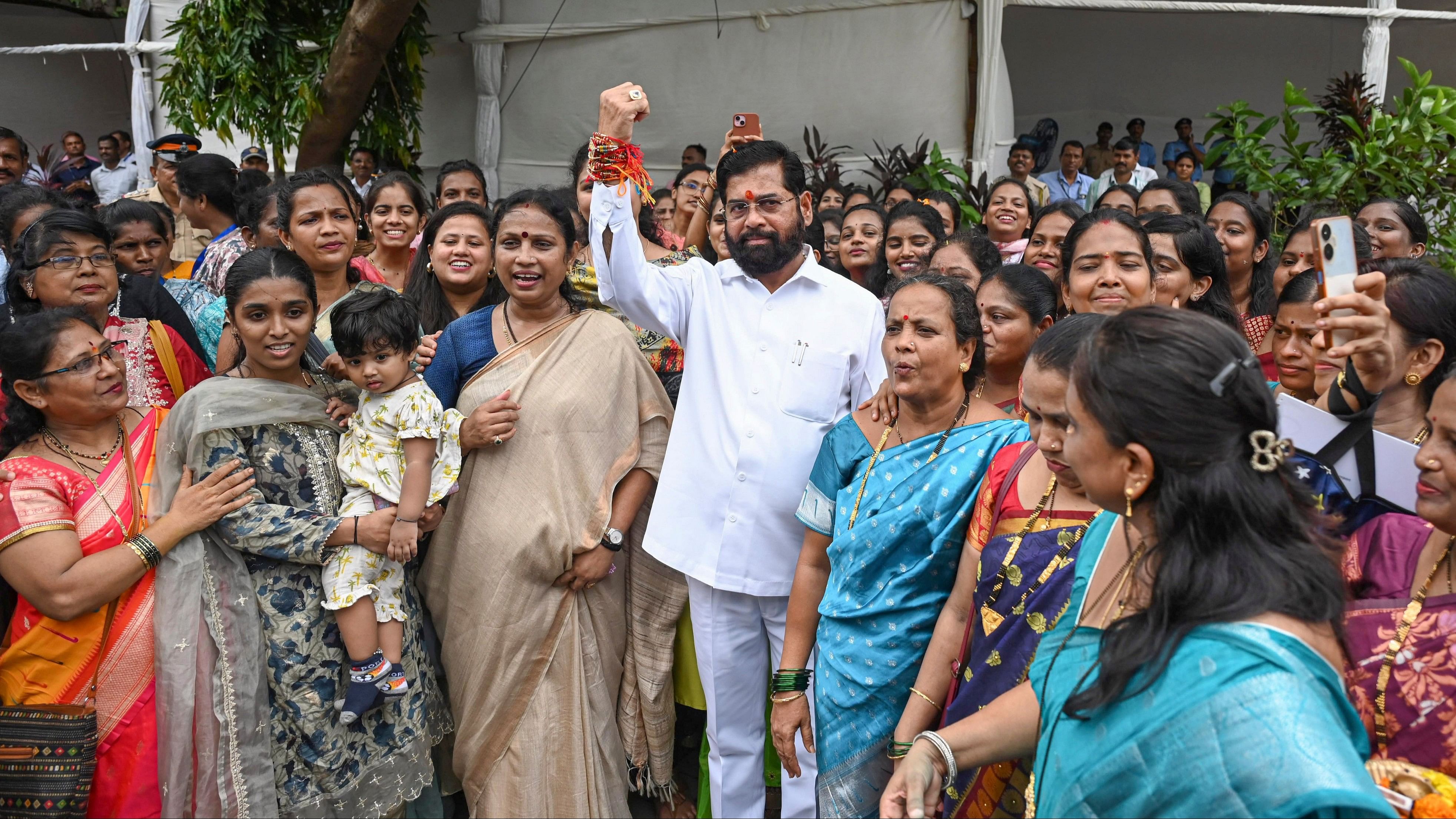 <div class="paragraphs"><p>Maharashtra Chief Minister Eknath Shinde poses for group photos with women who tied 'Rakhis' to him on the announcement of the 'Majhi Ladki Bahin' to support women financially in Maharashtra during the Monsoon session of Maharashtra Assembly, at Vidhan Bhavan in Mumbai, Saturday, June 29, 2024. </p></div>