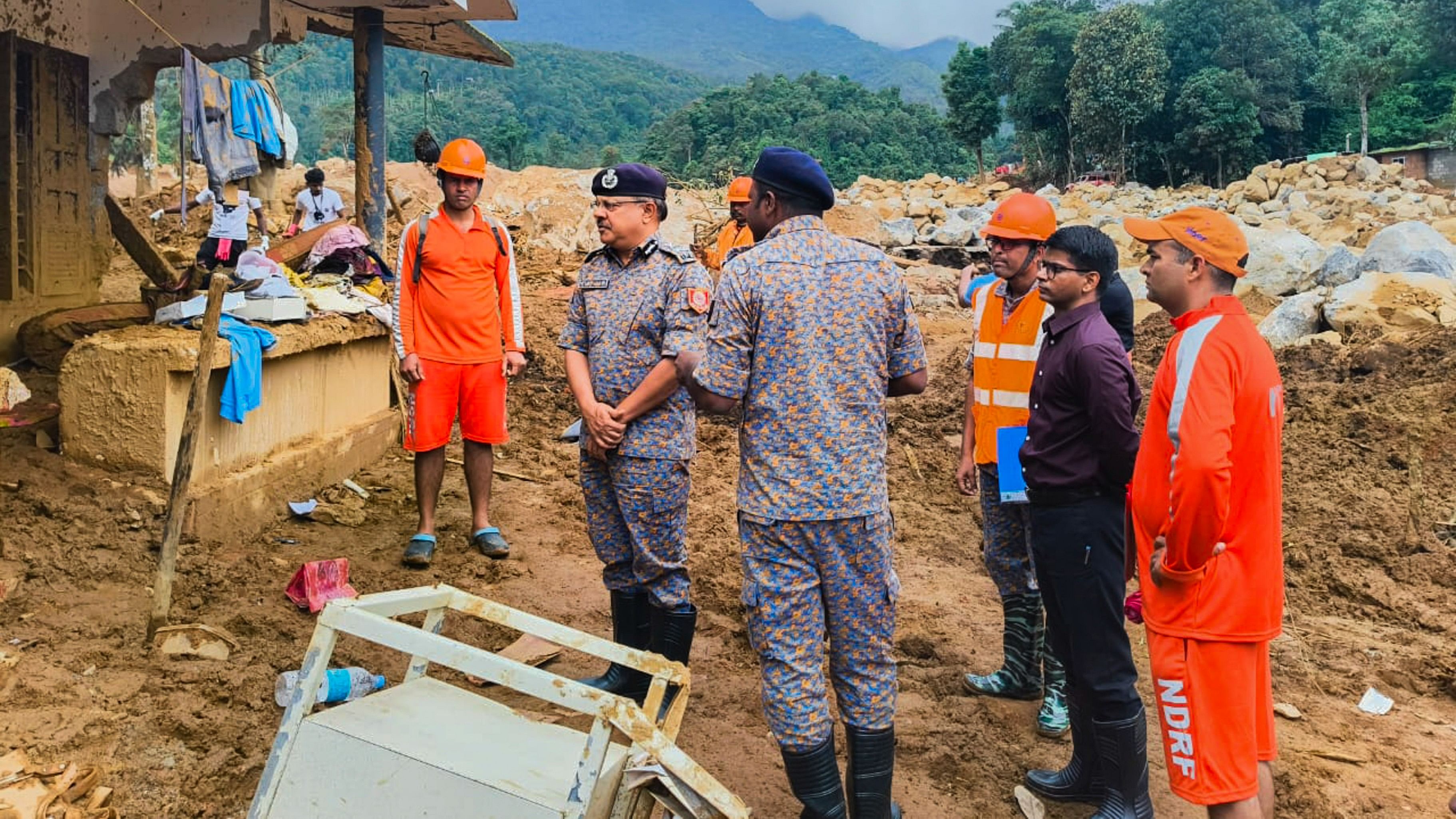 <div class="paragraphs"><p>Director General of National Disaster Response Force Piyush Anand along with officials and soldiers inspects rescue operations in the landslide affected areas of Wayanad, August 8, 2024.</p></div>