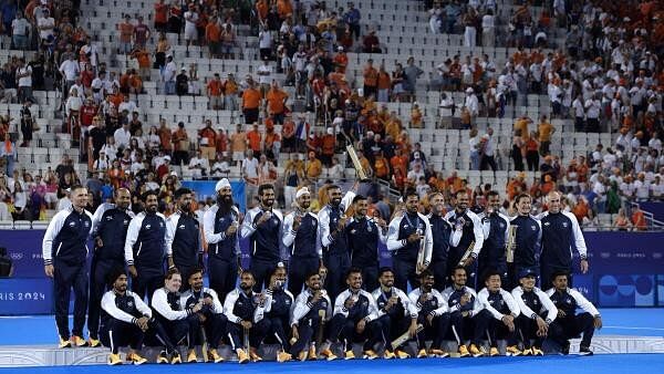 <div class="paragraphs"><p>Team India poses for a photograph after winning the bronze medal in the men's field hockey at the Yves-du-Manoir Stadium during the 2024 Summer Olympics, Thursday, Aug. 8, 2024, in Colombes, France.</p></div>