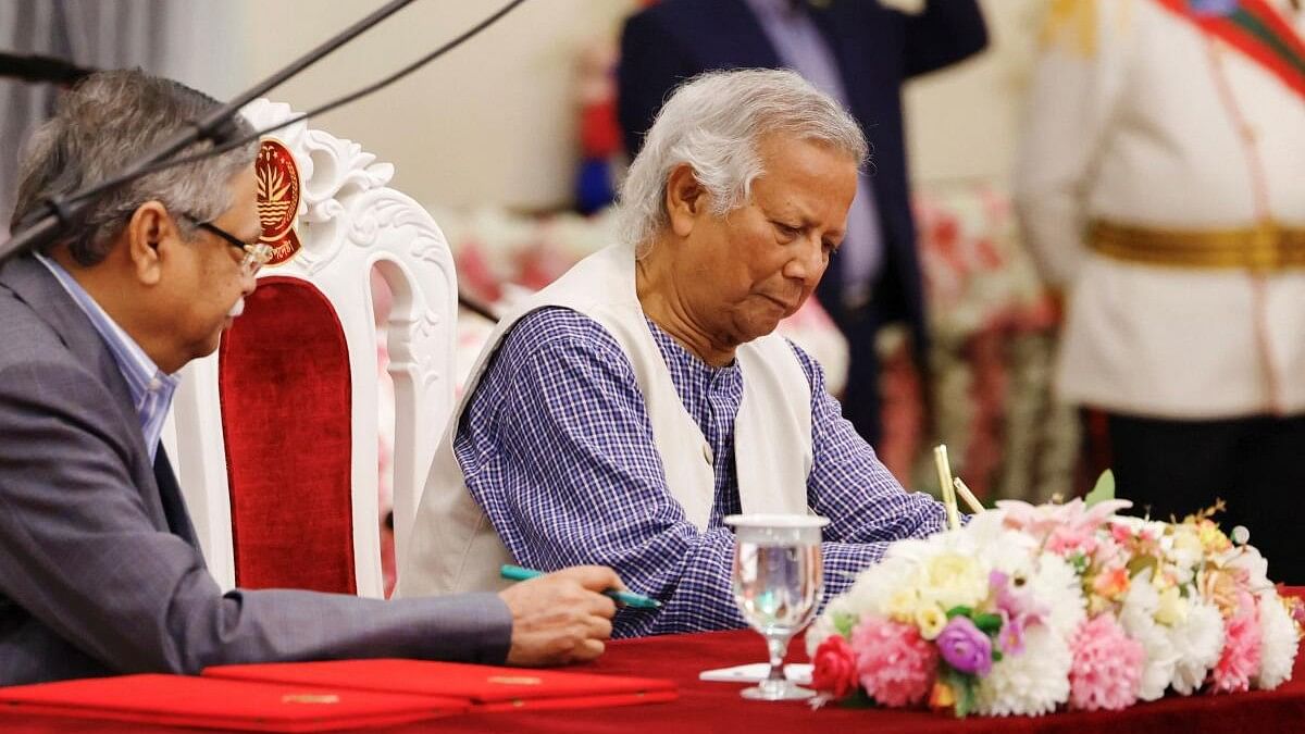 <div class="paragraphs"><p>Nobel laureate Muhammad Yunus signs the oath book as the country’s head of the interim government in Bangladesh at the Bangabhaban, in Dhaka, Bangladesh, August 8, 2024. </p></div>