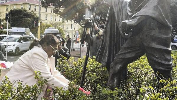 <div class="paragraphs"><p>President Droupadi Murmu pays floral tribute at the statue of Mahatma Gandhi near Wellington railway station in New Zealand.</p></div>