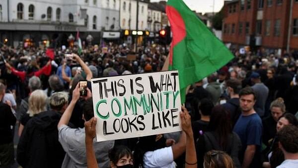 <div class="paragraphs"><p>People gather against an anti-immigration protest, in London, Britain.</p></div>