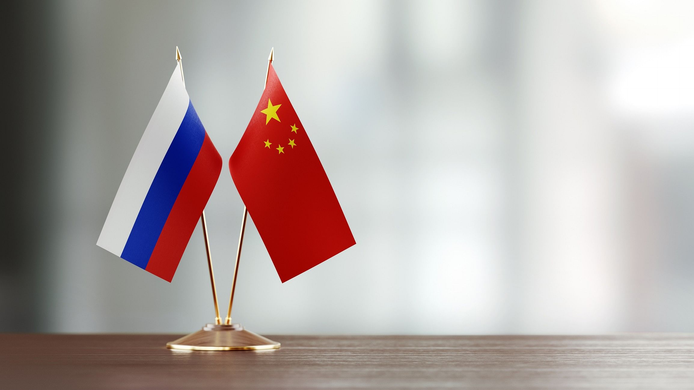 <div class="paragraphs"><p>Russia and China flags</p></div>