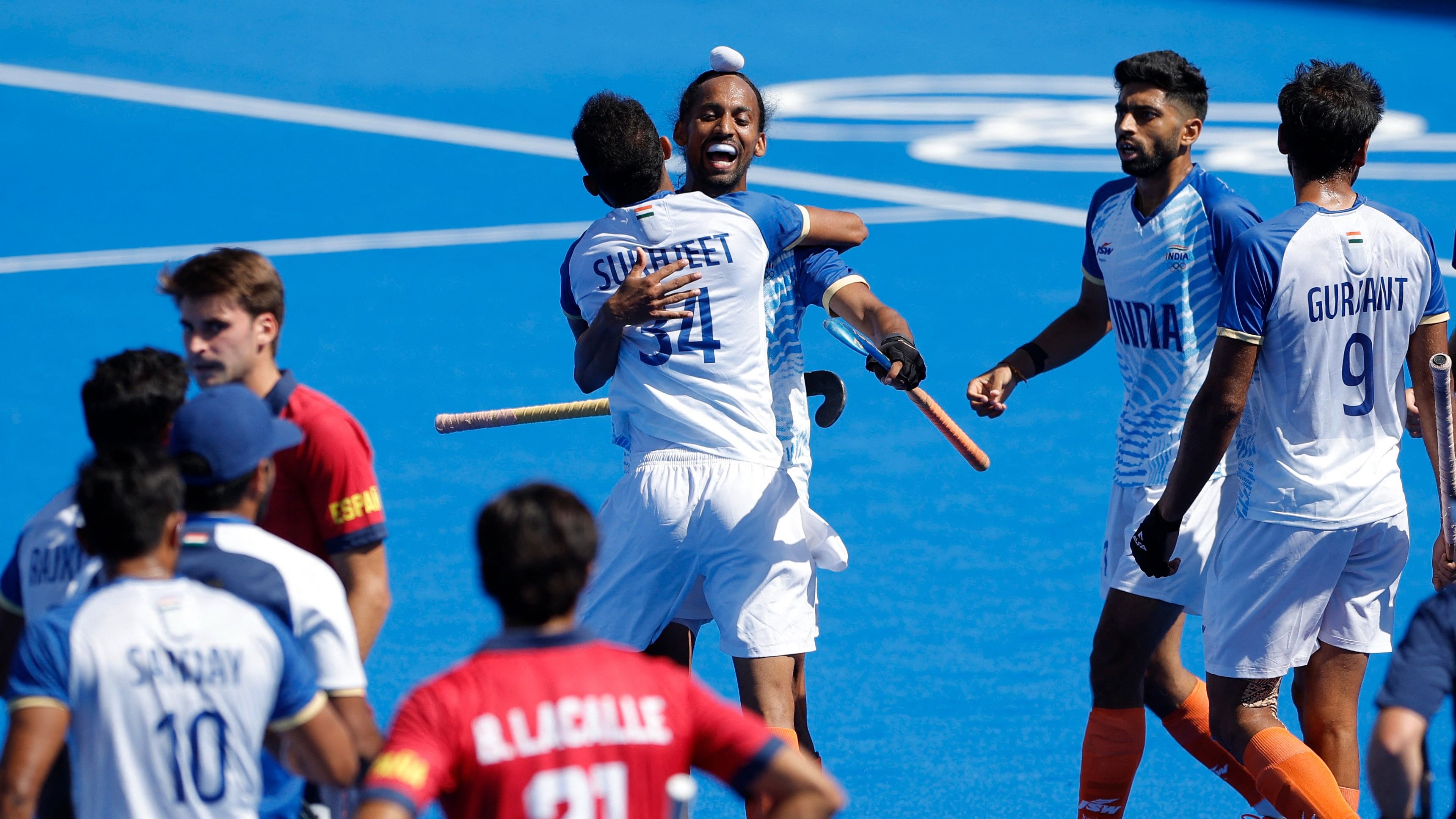 <div class="paragraphs"><p>Sukhjeet Singh of India and Hardik Singh of India celebrate with teammates winning the match</p></div>