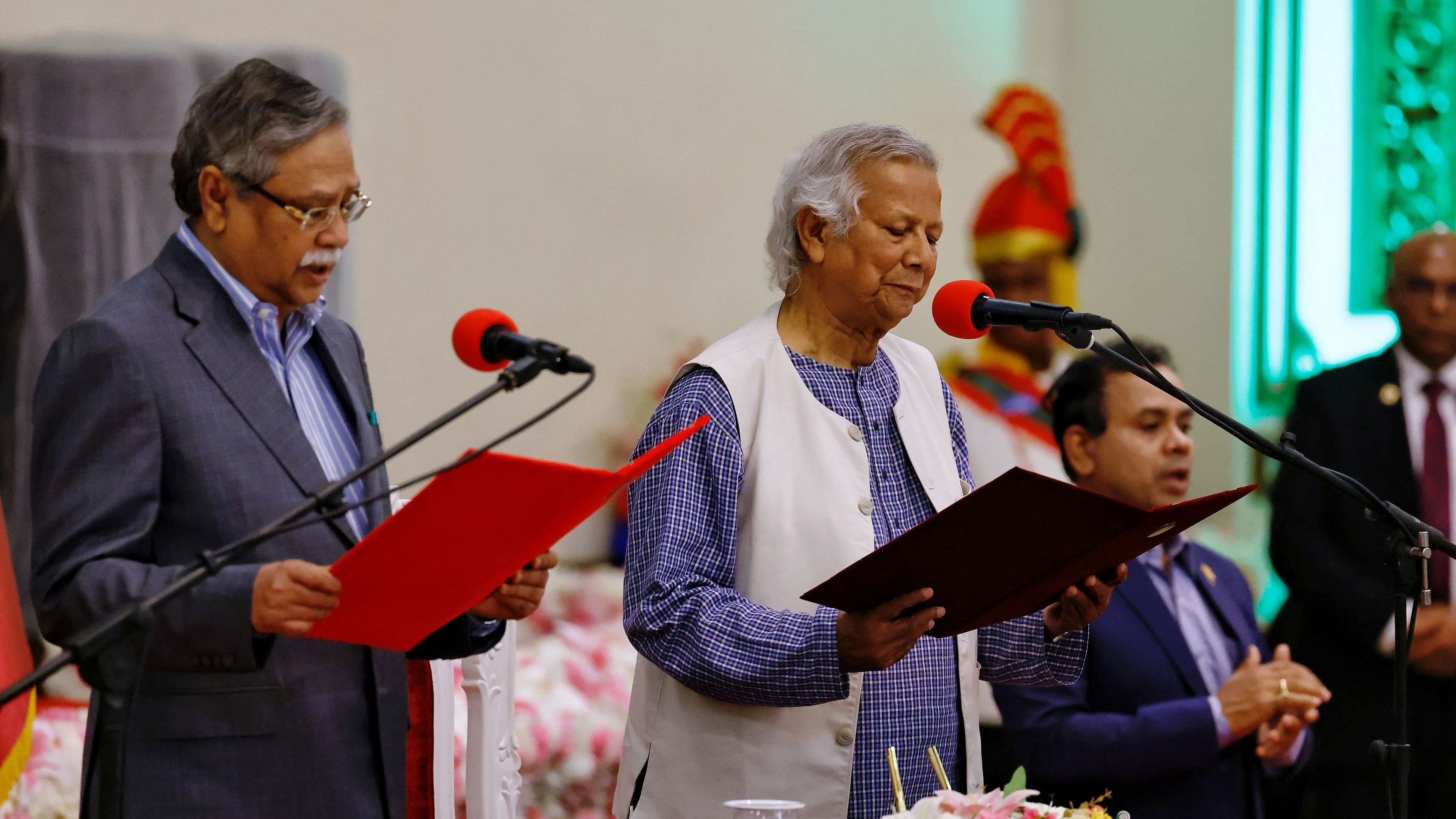 <div class="paragraphs"><p>Bangladeshi President Mohammed Shahabuddin administers oath-taking ceremony of Nobel laureate Muhammad Yunus as the country?s head of the interim government in Bangladesh at the Bangabhaban, in Dhaka, Bangladesh, August 8, 2024. </p></div>