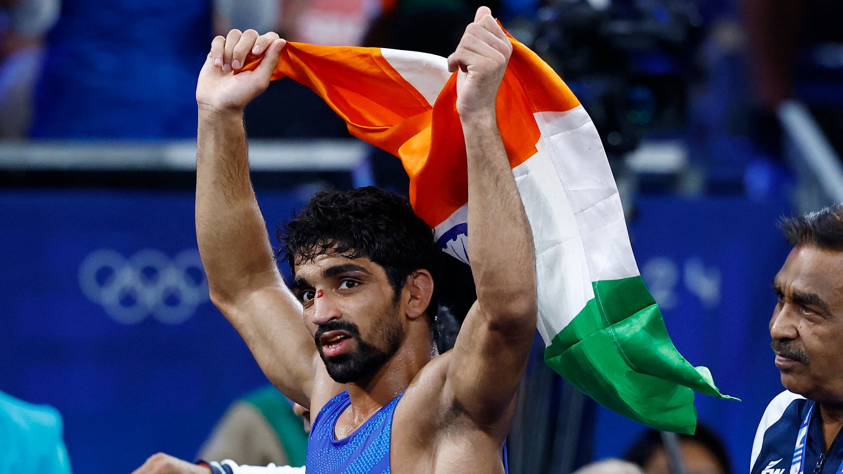 <div class="paragraphs"><p>Aman Sehrawat  celebrates winning bronze in the match against Darian Toi Cruz of Puerto Rico. </p></div>