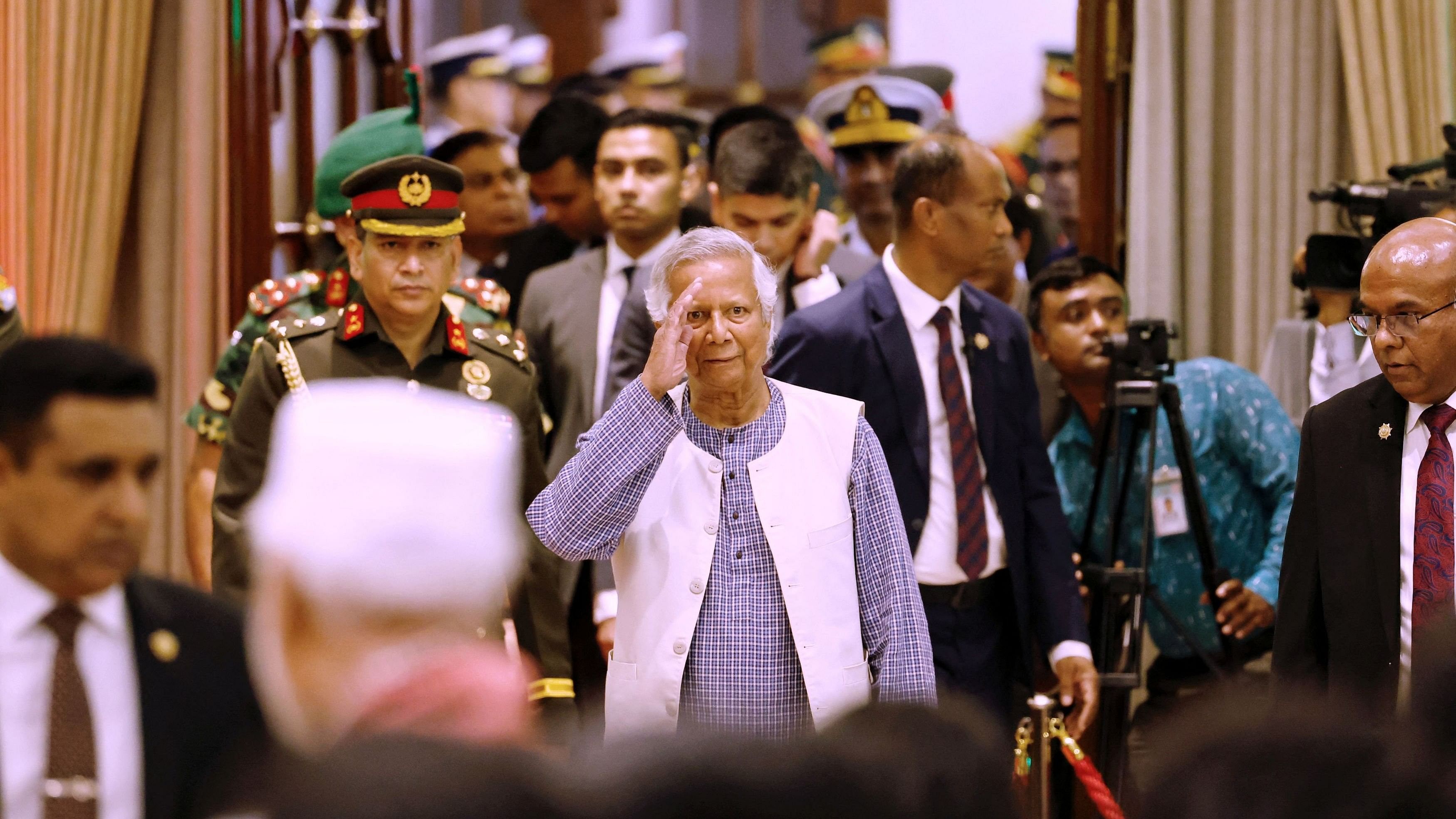 <div class="paragraphs"><p>Nobel laureate Muhammad Yunus salutes to the attendees upon arrival at the Bangabhaban to take oath as the head of the interim government, in Dhaka, Bangladesh, August 8, 2024. </p></div>