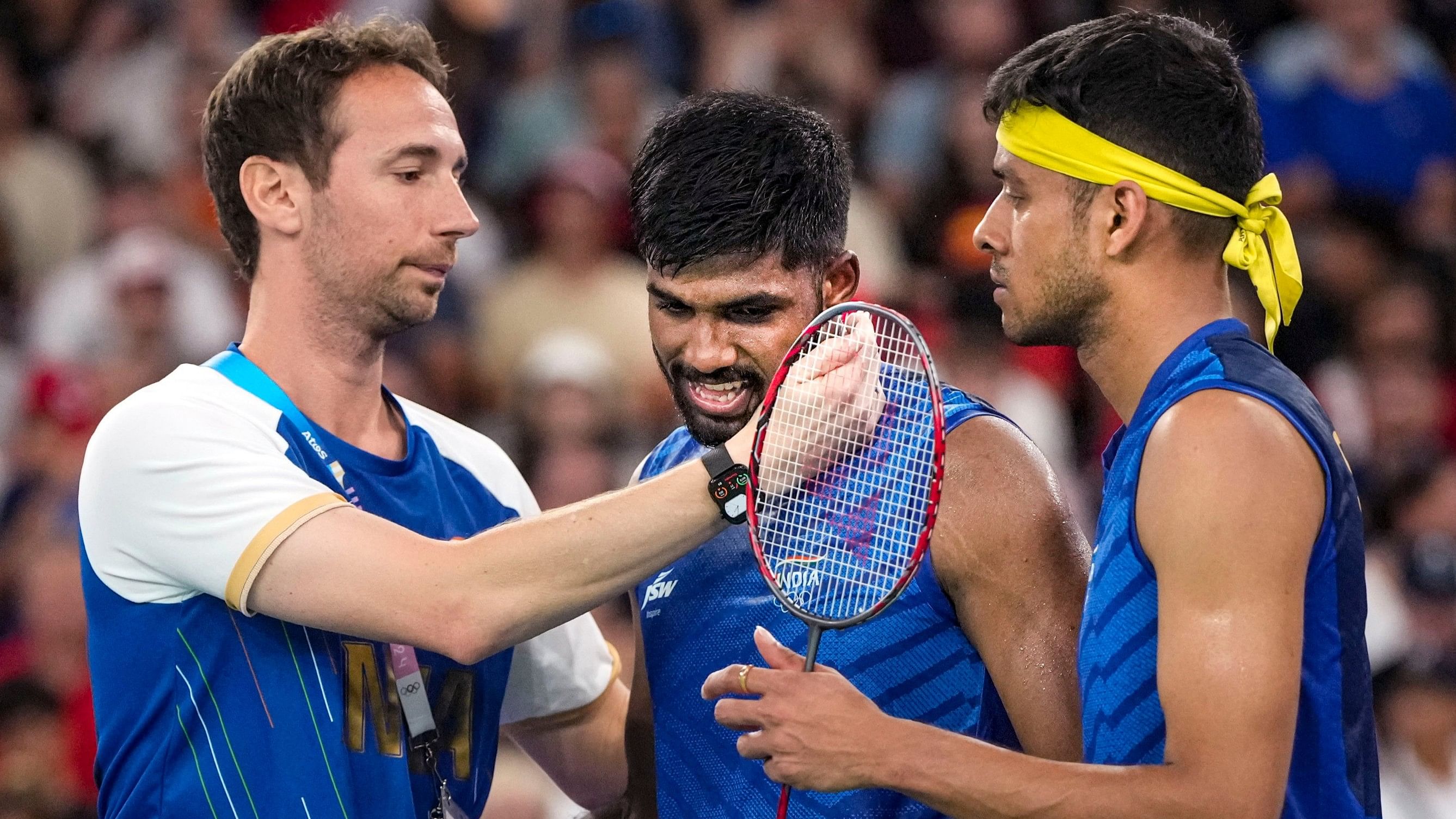 <div class="paragraphs"><p>Satwiksairaj Rankireddy and Chirag Shetty with coach Mathias Boe after losing the Men’s Doubles Badminton Quarterfinals at the Paris Olympics. </p></div>