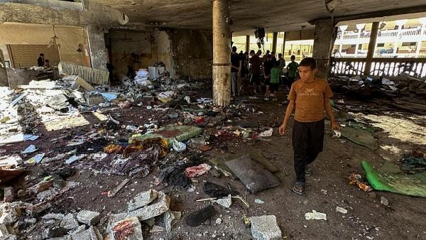 <div class="paragraphs"><p>Aftermath of an Israeli strike on a school sheltering displaced people in Gaza City.</p></div>