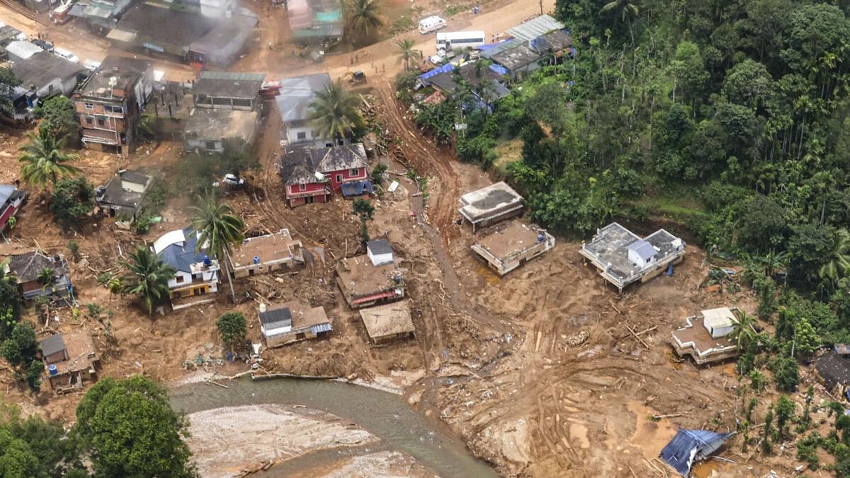 <div class="paragraphs"><p>A view of the landslide-hit areas as Prime Minister Narendra Modi carries out an aerial survey, in Wayanad district.</p></div>