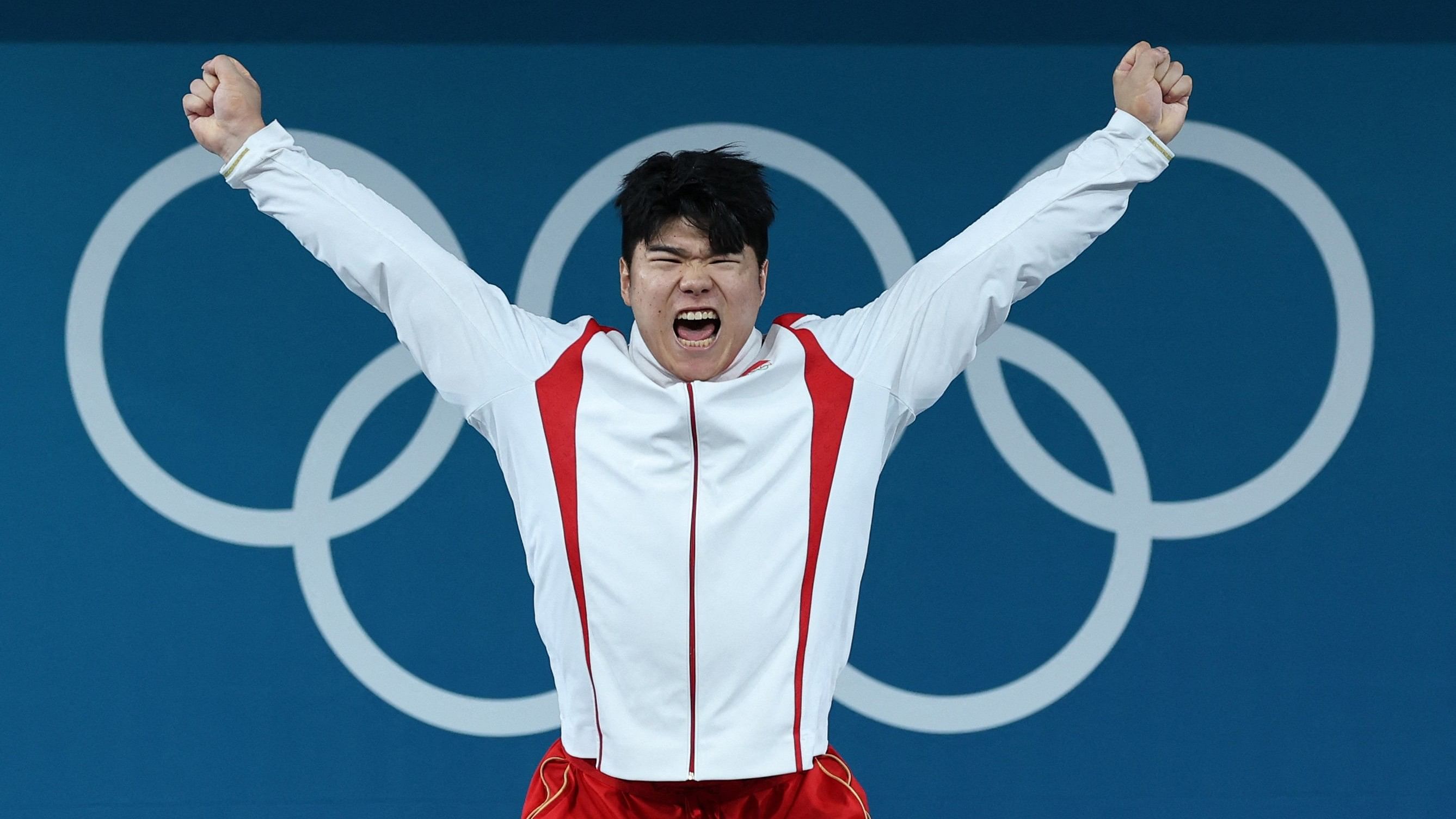 <div class="paragraphs"><p> Gold medallist Liu of China celebrates on the podium. </p></div>