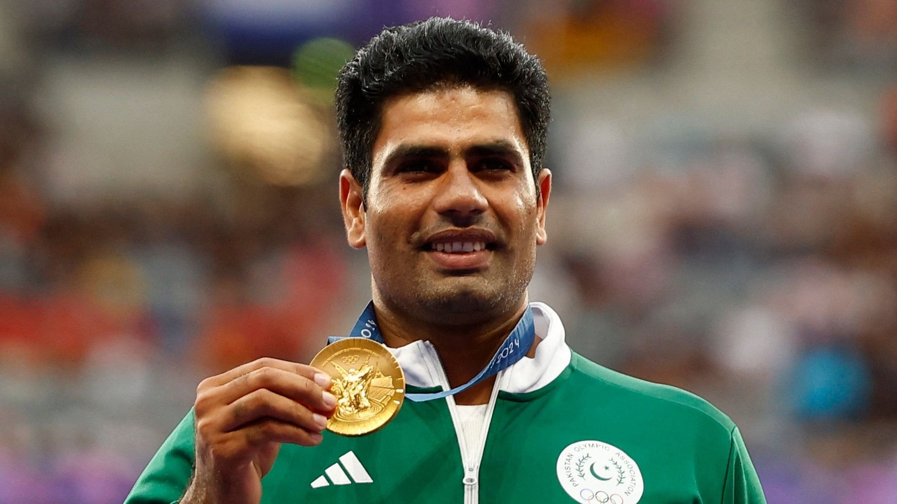 <div class="paragraphs"><p>Gold medallist Arshad Nadeem of Pakistan celebrates with his medal on the podium </p></div>