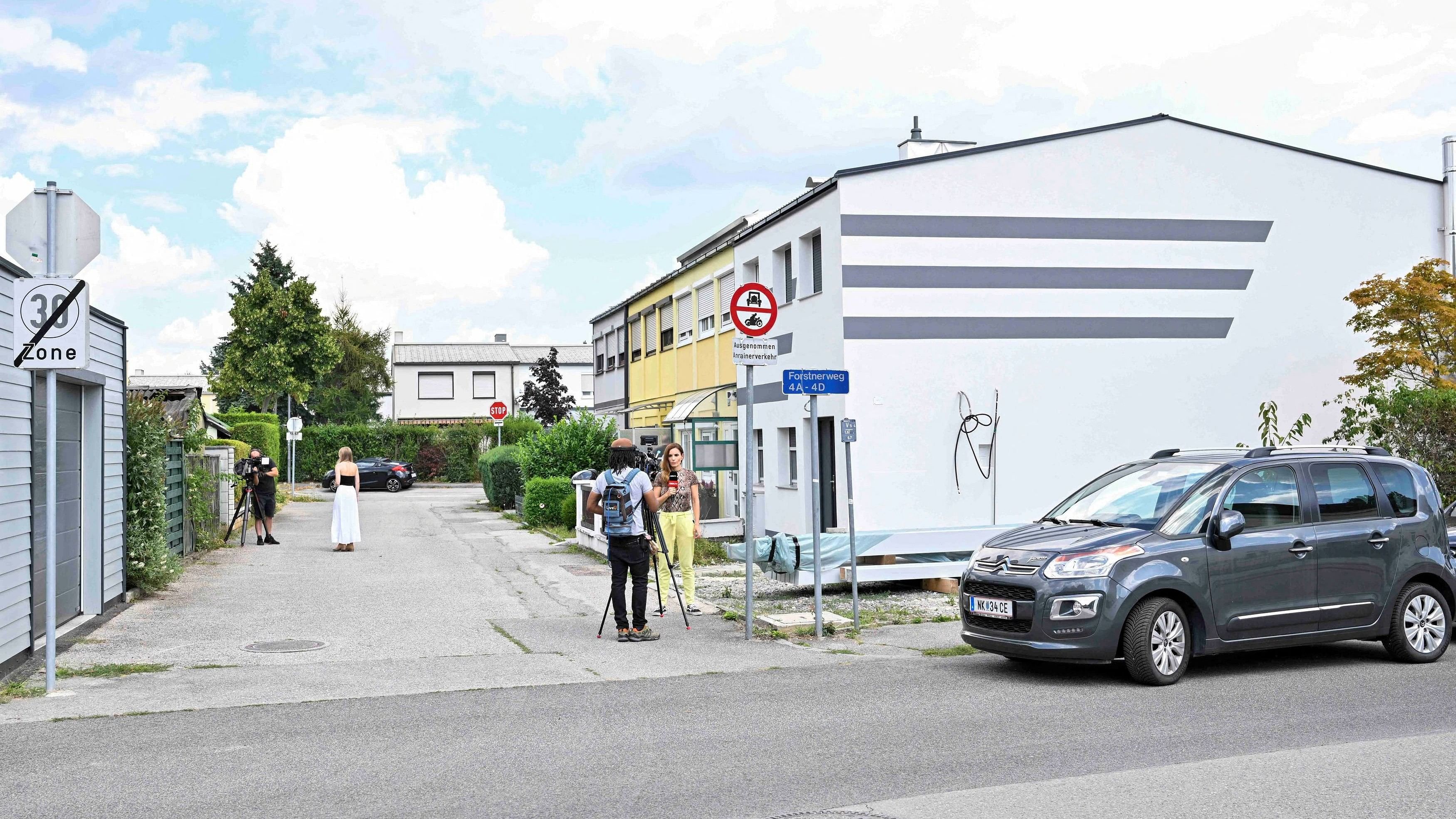 <div class="paragraphs"><p>Members of the media stand in an area where the main suspect lives, following the cancellation of three Taylor Swift concerts at Happel stadium in Vienna after the government confirmed a planned attack at the venue, in Ternitz, Austria.</p></div>