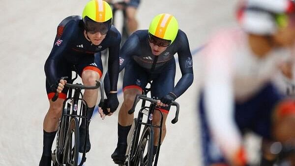 <div class="paragraphs"><p>Paris 2024 Olympics - Track Cycling - Men's Madison, Final - Saint-Quentin-en-Yvelines Velodrome, Montigny-le-Bretonneux, France - August 10, 2024: Oliver Wood of Britain and Mark Stewart of Britain in action. </p></div>