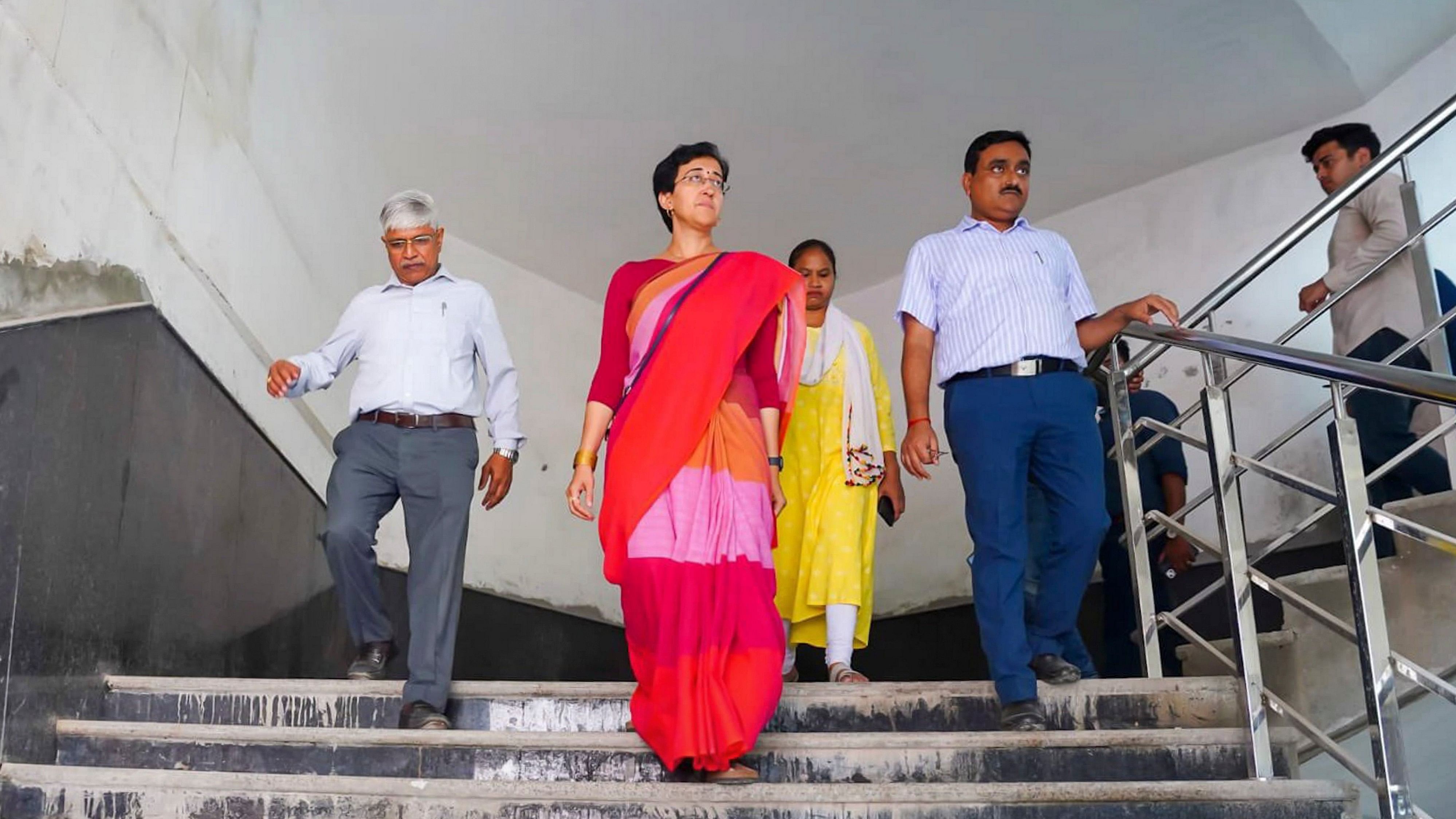 <div class="paragraphs"><p>Delhi Minister Atishi inspects an under construction school building at Sundar Nagari, in New Delhi.   </p></div>