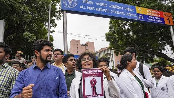 <div class="paragraphs"><p>Doctors protest against the sexual assault and killing of a postgraduate trainee doctor in Kolkata, near AIIMS in New Delhi, Monday, Aug. 12, 2024.</p></div>