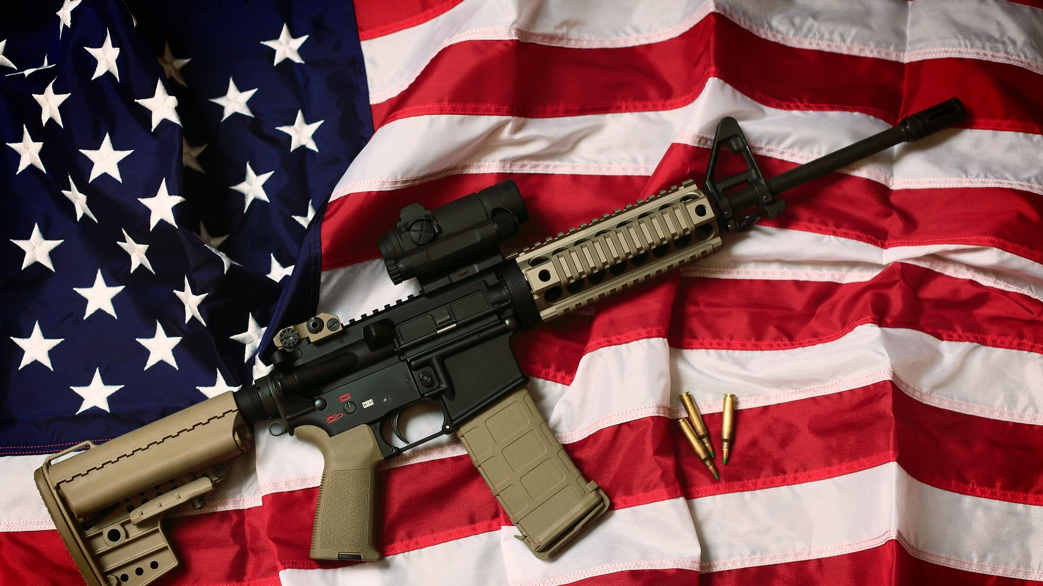 <div class="paragraphs"><p>AR-15 placed on the US flag&nbsp;</p></div>