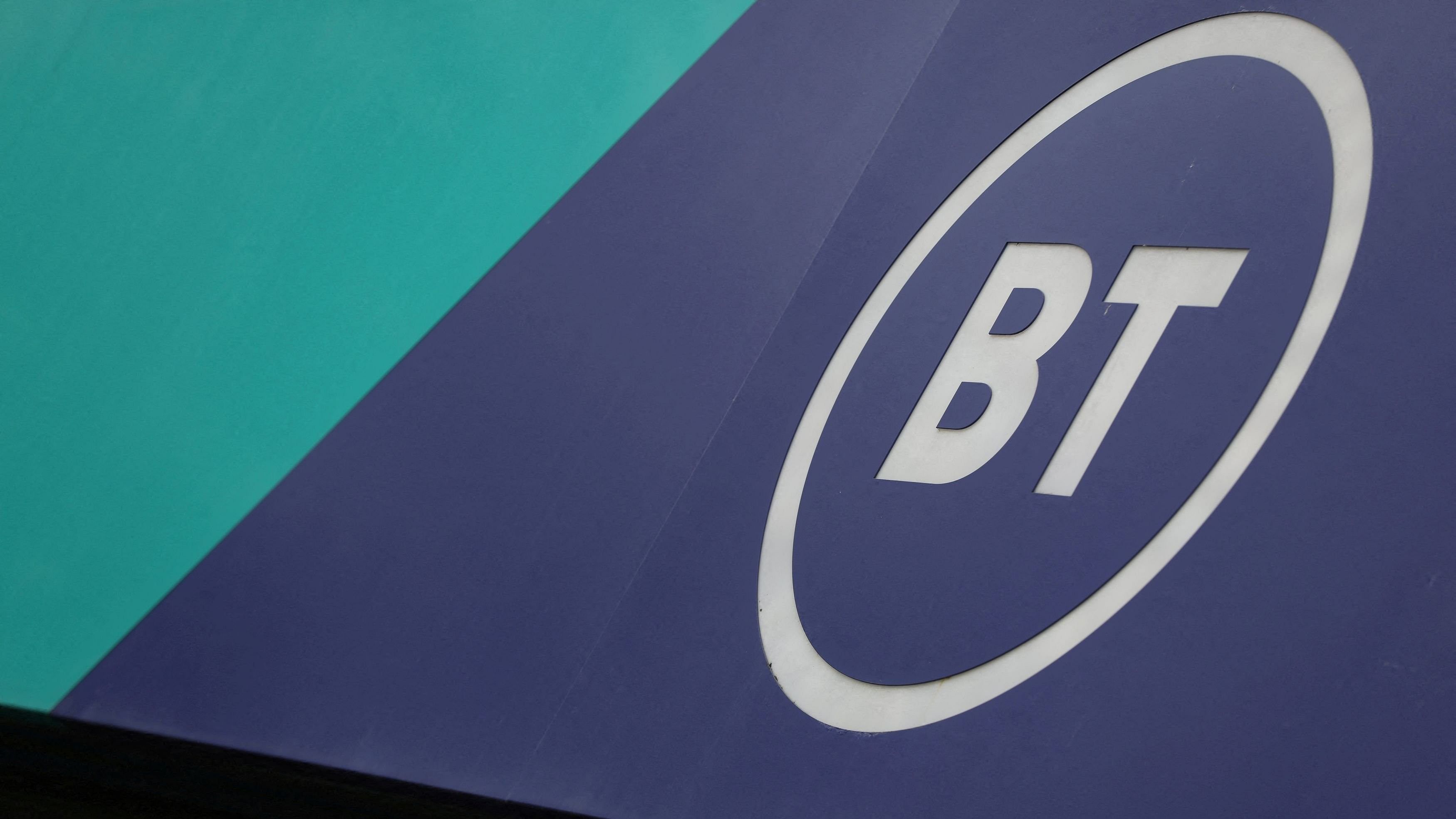 <div class="paragraphs"><p>A view of BT Group logo displayed on a shopfront, in London</p></div>