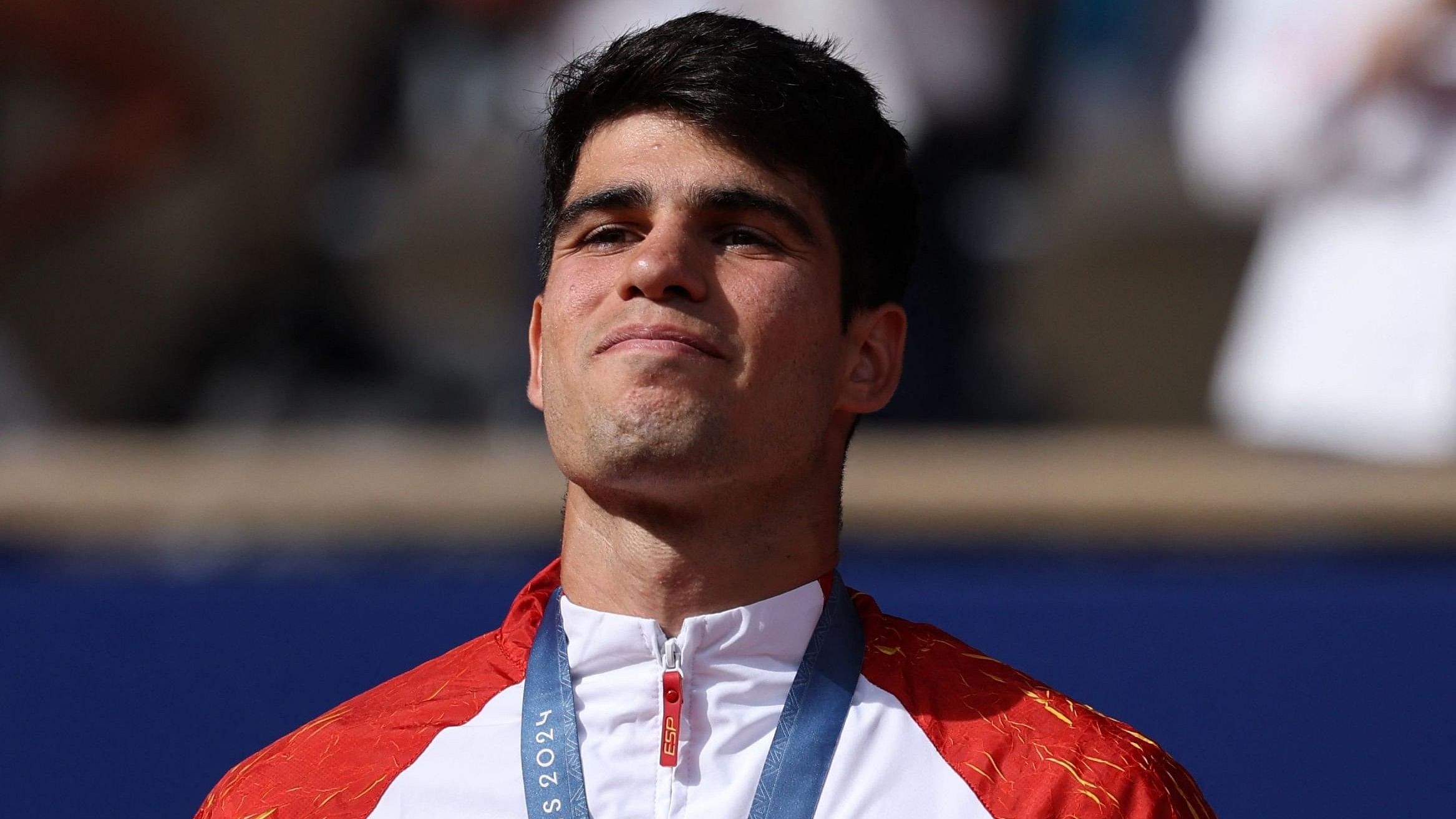 <div class="paragraphs"><p>Olympics silver medallist Carlos Alcaraz of Spain on the podium in Paris.</p></div>