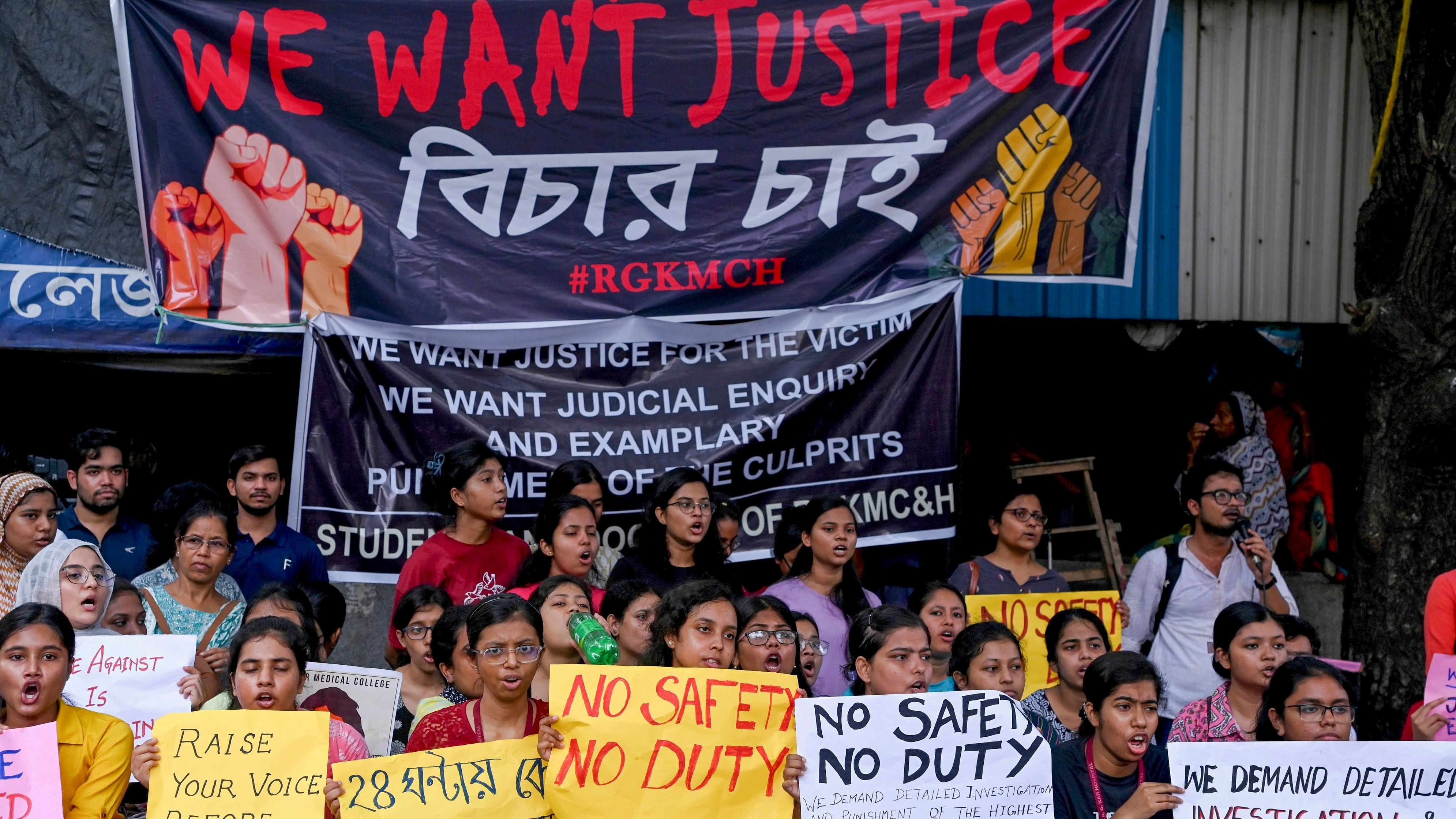 <div class="paragraphs"><p>Kolkata: Doctors and nursing staff protest against the recent the rape and murder of a woman doctor inside the RG Kar Medical College and Hospital, in Kolkata, Sunday, Aug. 11, 2024.</p></div>