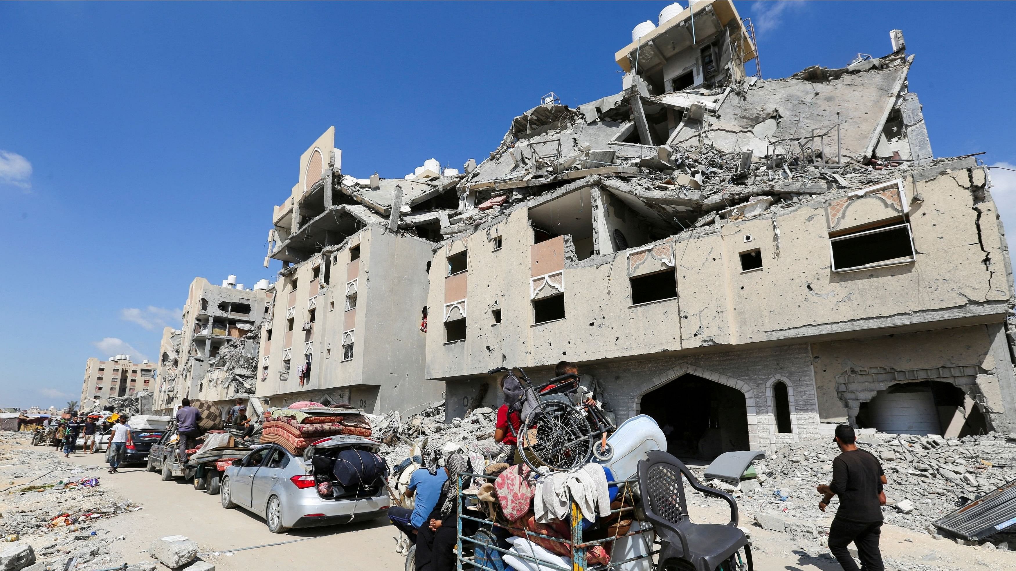 <div class="paragraphs"><p>Displaced Palestinians make their way as they flee Hamad City following an Israeli evacuation order, amid Israel-Hamas conflict, in Khan Younis in the southern Gaza Strip.</p></div>