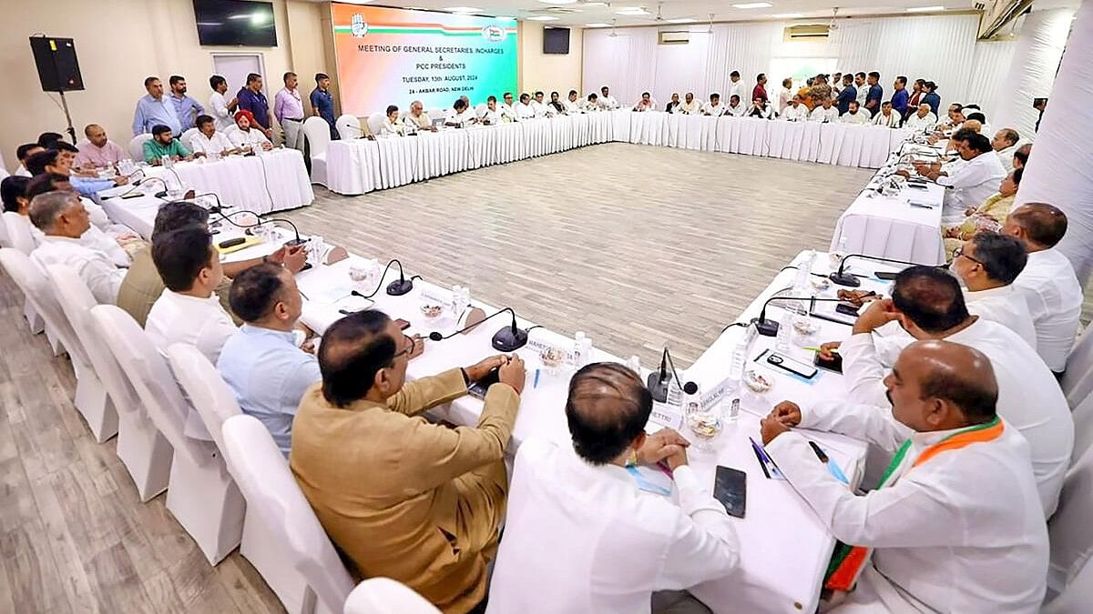 <div class="paragraphs"><p>Congress President Mallikarjun Kharge with party leader Rahul Gandhi and others during a meeting.</p></div>