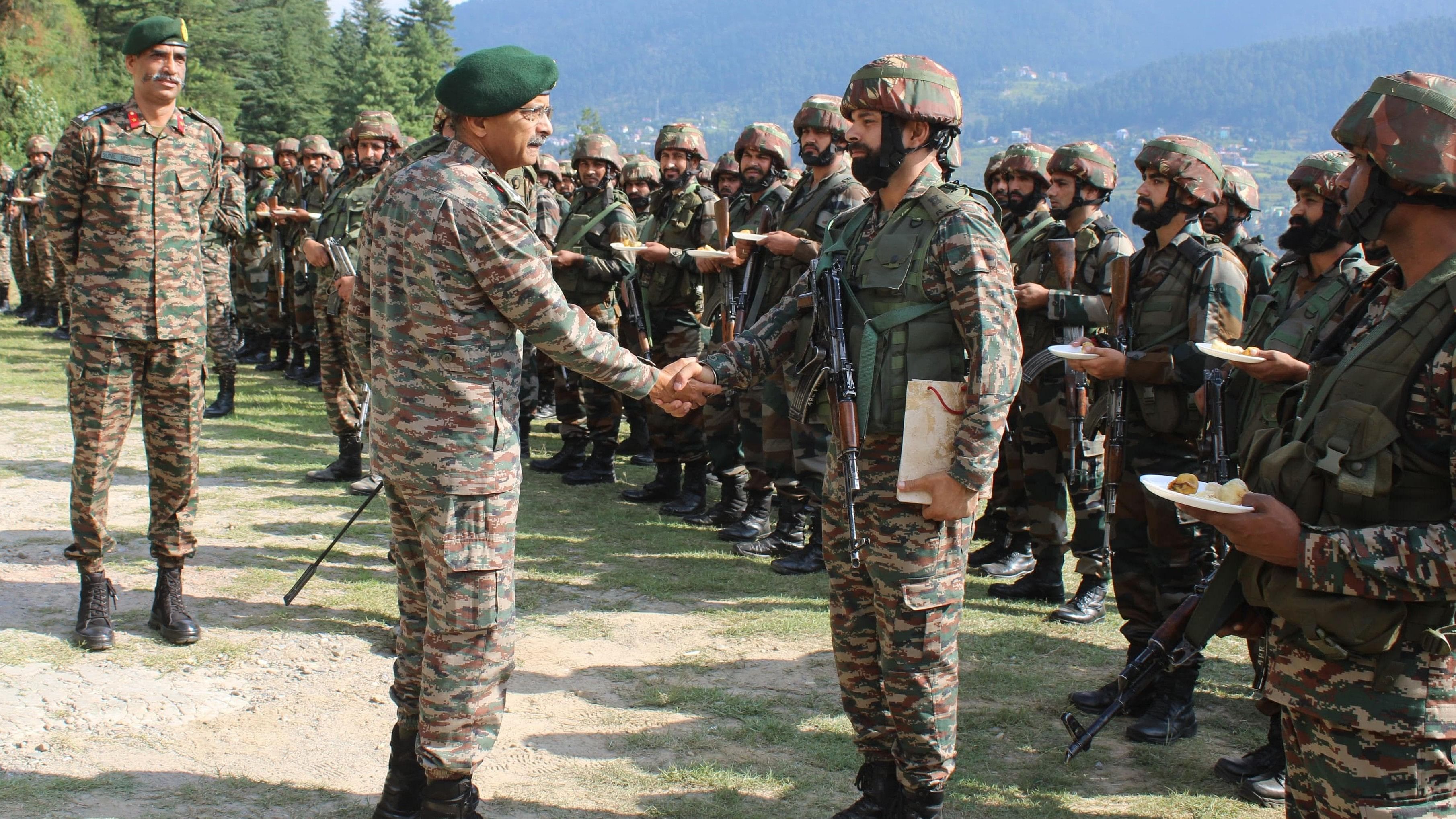 <div class="paragraphs"><p>Northern Army Commander Lt Gen M V Suchindra Kumar with Indian army soldiers in Chenab valley on August 13, 2024.</p></div>