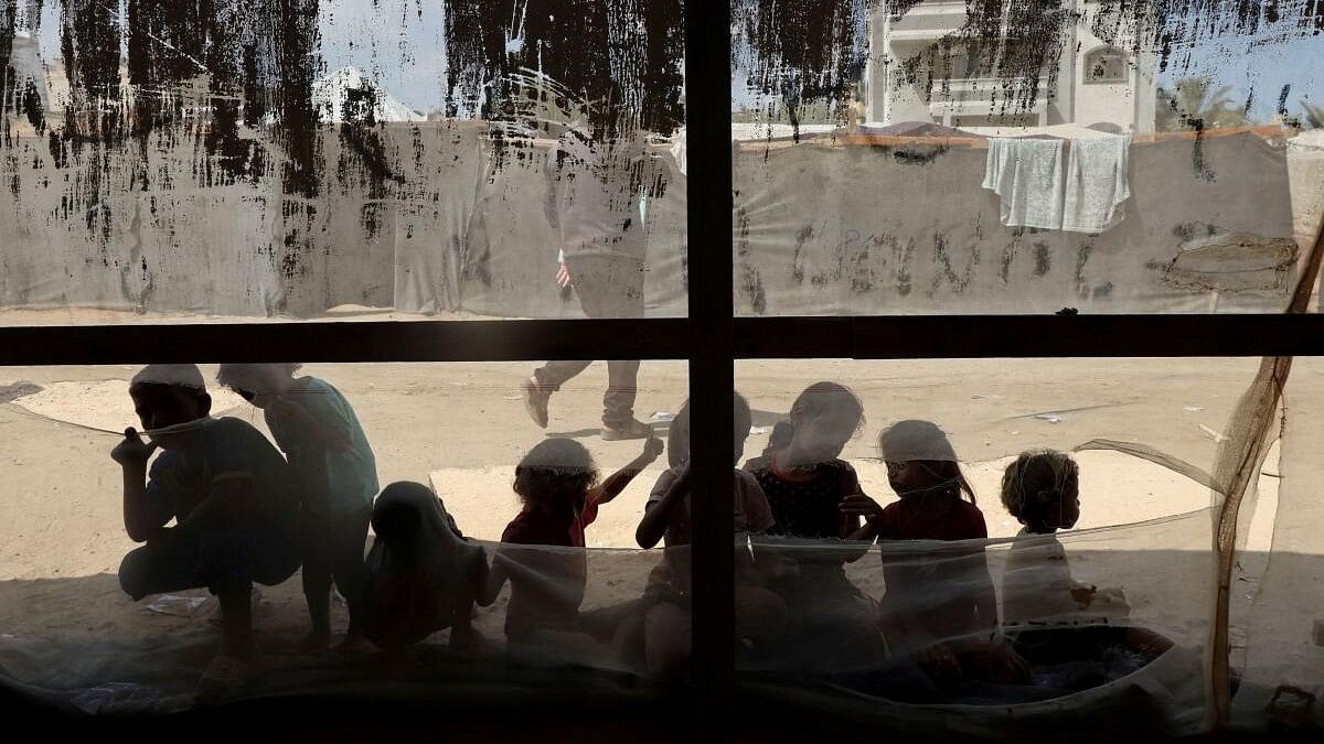 <div class="paragraphs"><p>Palestinian children play outside a medical tent where Lobna al-Azaiza, a Palestinian pediatrician, provides free medical services to displaced Palestinians, in Deir Al-Balah in the central Gaza Strip.</p></div>