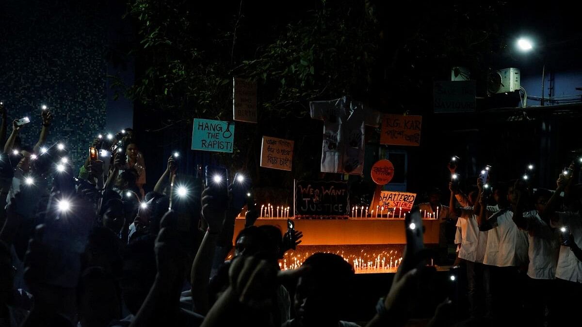 <div class="paragraphs"><p>Doctors and medical students hold their phone flashlights in protest against what they say is rape and murder of a trainee doctor, inside the premises of Dr. R. Ahmed Dental College and Hospital in Kolkata.</p></div>