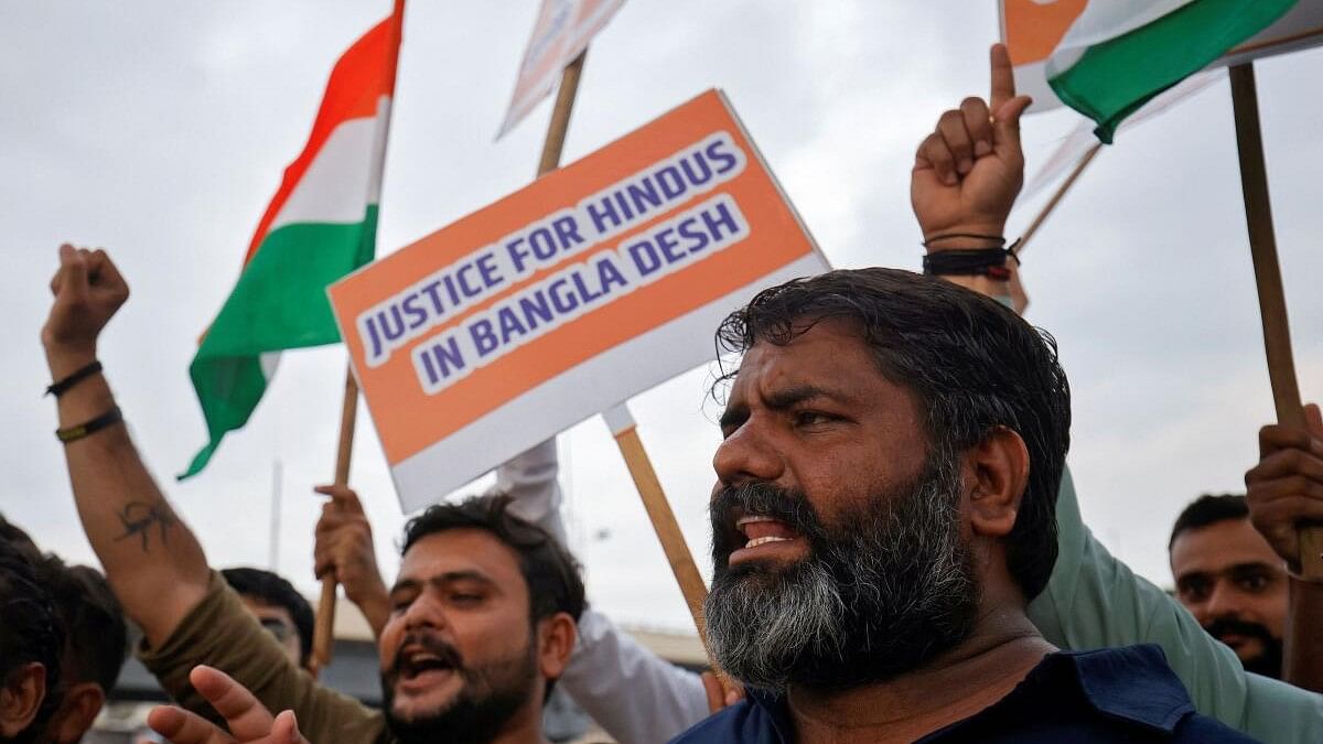 <div class="paragraphs"><p>Hindu activists stage protest in Ahmedabad against attacks on religious places of Hindus in Bangladesh in Ahmedabad.</p></div>