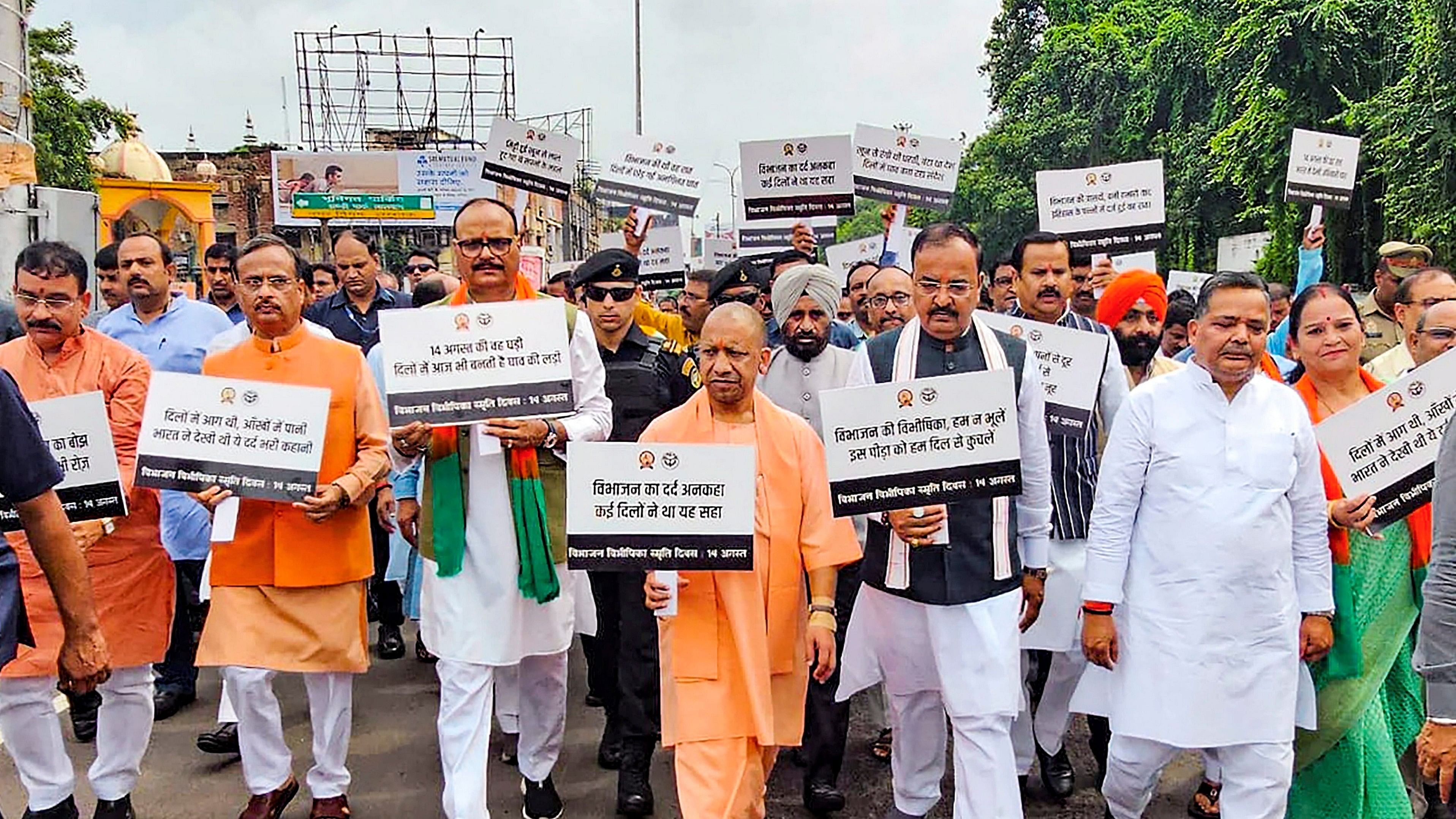 <div class="paragraphs"><p>Uttar Pradesh Chief Minister Yogi Adityanath with Deputy CMs Keshav Prasad Maurya and Brajesh Pathak during a silent march to commemorate the victims on 'Partition Horrors Remembrance Day', in Lucknow,.</p></div>