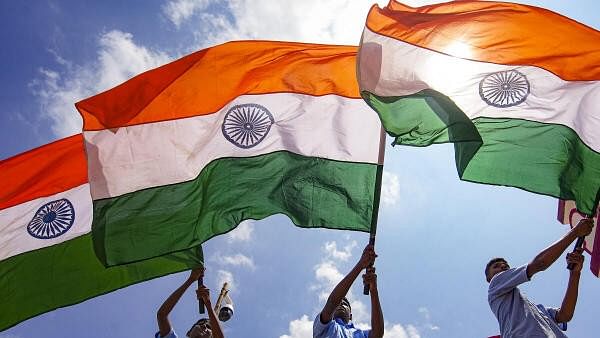 <div class="paragraphs"><p>School students wave the national flags.</p></div>