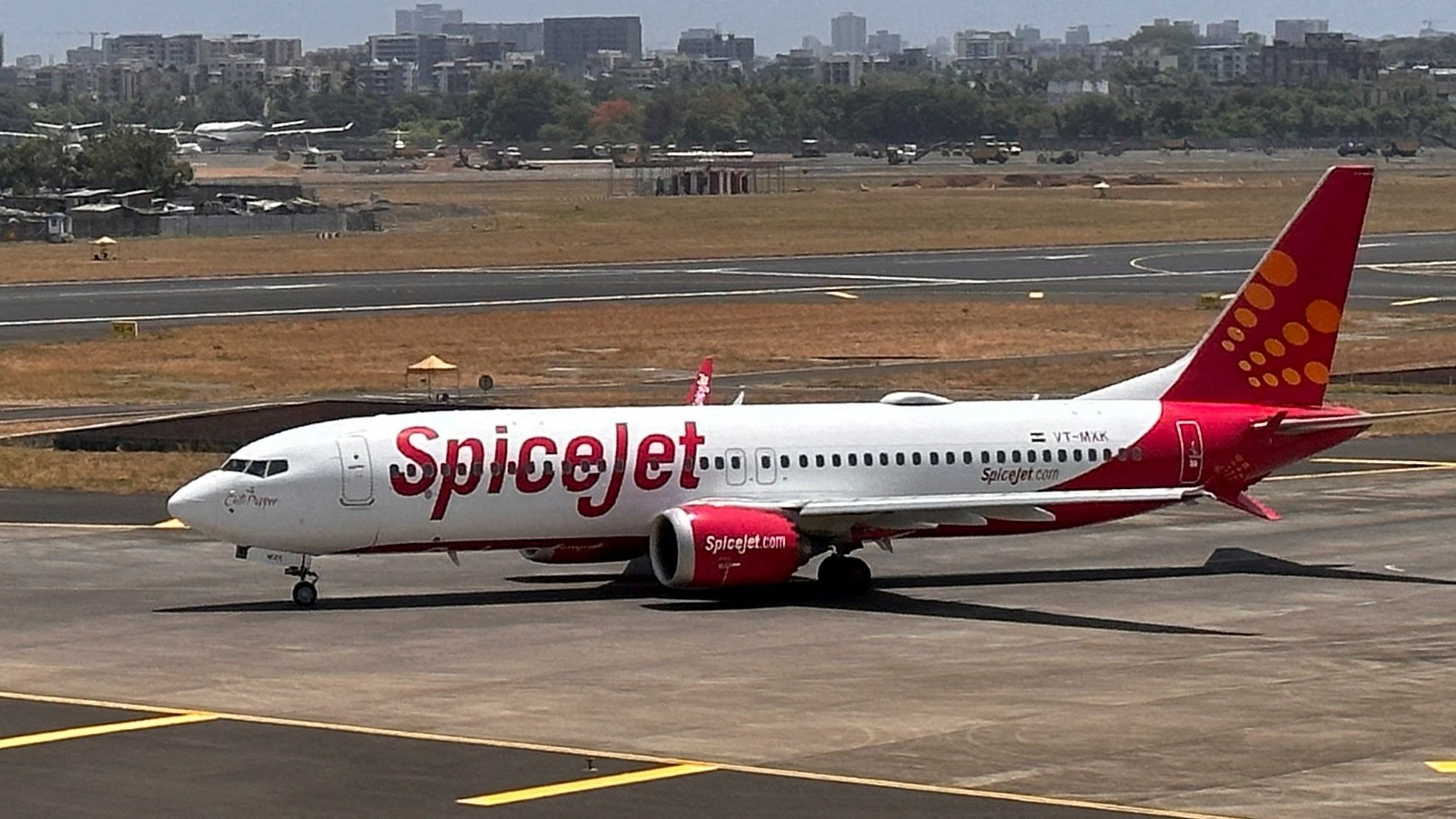 <div class="paragraphs"><p>A SpiceJet passenger aircraft taxis on the tarmac at Chhatrapati Shivaji International Airport in Mumbai.&nbsp;</p></div>