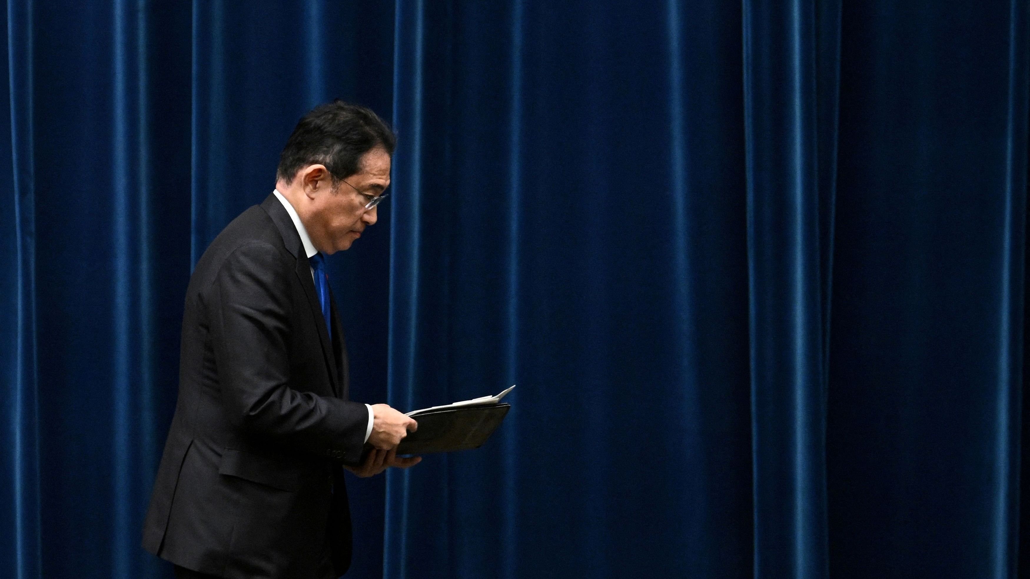 <div class="paragraphs"><p>Japan's Prime Minister Fumio Kishida leaves at the end of a press conference at the prime minister's office in Tokyo on August 14, 2024. Kishida confirmed on August 14 that he will not seek re-election as head of his party next month.&nbsp;</p></div>